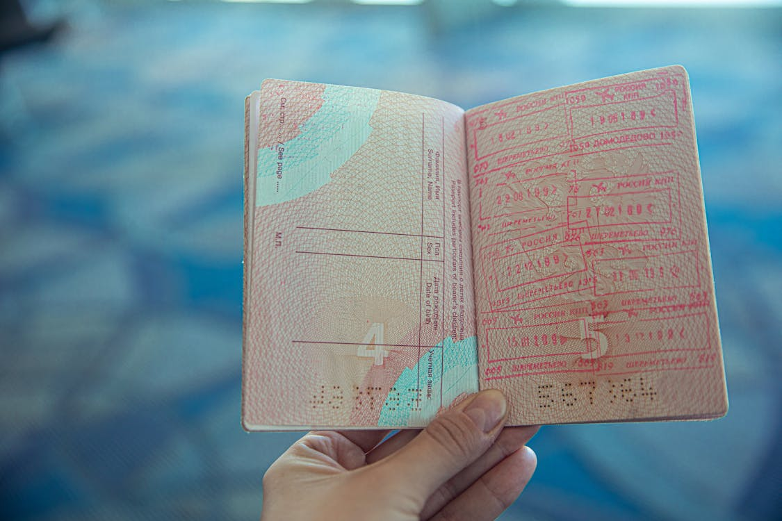 an individual holding up their passport